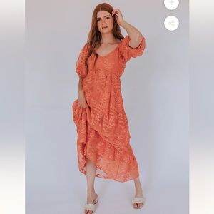 Stunning coral dress with beautiful tulle overlay and pockets size large